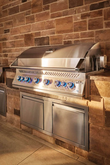 The Napoleon Grills Built-In 700 Series 44-Inch Gas Grill Head installed in a custom outdoor kitchen with stone finish, blending elegance and professional grilling performance.