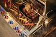 The Napoleon Grills Built-In 700 Series 44-Inch Gas Grill Head in action with rotisserie and assorted grilled vegetables, illustrating the grill's capacity for entertaining and gourmet cooking.