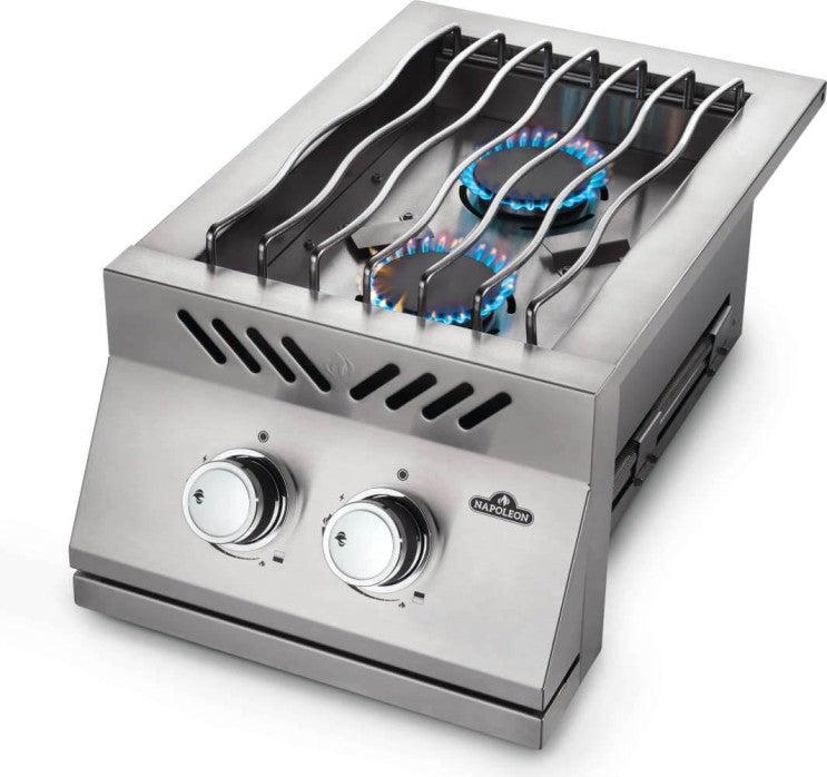 Angled view of Napoleon Grills Built-In 500 Series 10-inch single range top burner with blue flame active