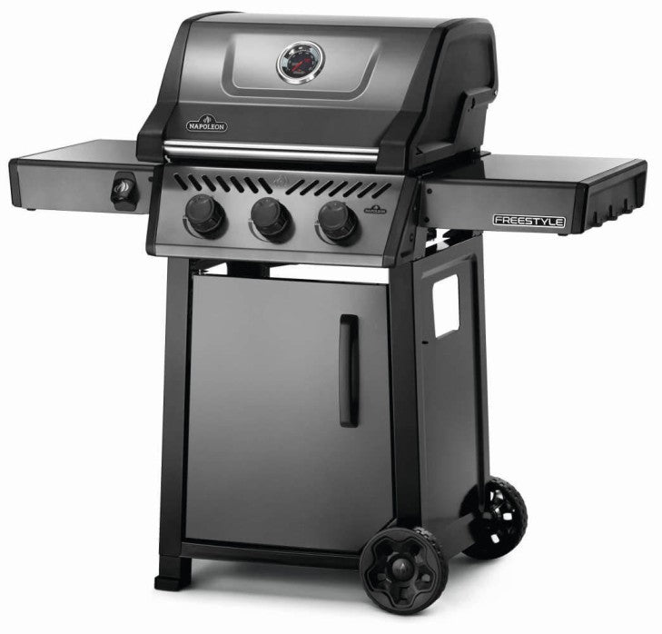 Angled view of Napoleon Grills Freestyle 365 3-Burner Gas Grill showing the grill's side shelves and burner controls.