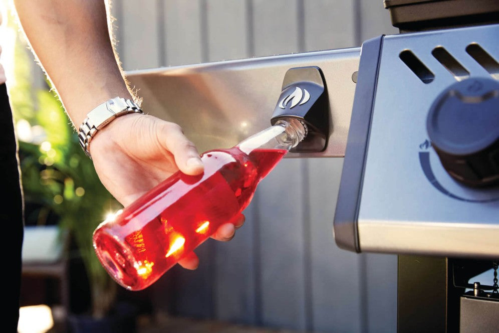 A close-up of the integrated bottle opener feature on the Napoleon Grills Freestyle 425.