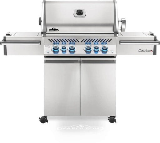 Front view of the Napoleon Grills Prestige PRO™ 500 RSIB 6-Burner Grill with infrared side and rear burners, featuring stainless steel construction and blue-lit control knobs.