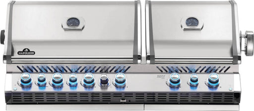 Front view of Napoleon Grills Built-In Prestige PRO™ 825 RBI Gas Grill Head with blue illuminated control knobs and closed lid featuring a temperature gauge.