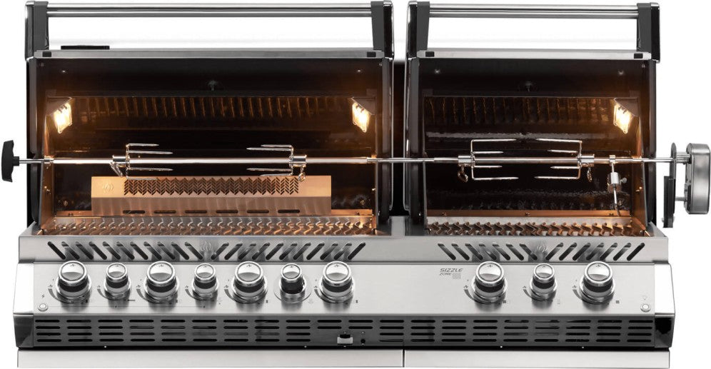  Interior view of Napoleon Grills Built-In Prestige PRO™ 825 RBI Gas Grill Head with the lid open, showcasing the rotisserie set and interior lighting.