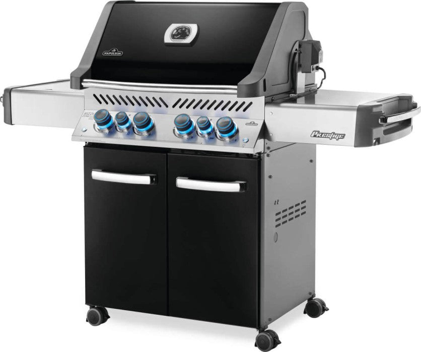 Angled view of the Napoleon Grills Prestige® 500 RSIB Grill showing the side shelf and the stainless steel accents on the control panel.