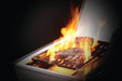 The Napoleon Grills Rogue SE 525 RSIB Grill's infrared side burner in use, with a focus on the flame and cooking surface.