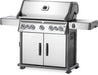 Angled view of Napoleon Grills Rogue SE 625 RSIB Stainless Steel 7-Burner Grill showing the side shelf and main cooking area.