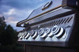  Illuminated control knobs on the Napoleon Grills Rogue SE 625 RSIB Grill during twilight, highlighting the grill's sleek design and functionality.