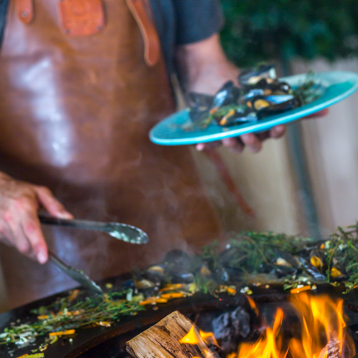 OFYR Classic Storage Corten 85 with a man grilling