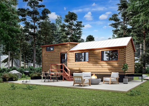 The cozy Pinecrest cabin from Oasis Tiny Estates nestled amongst tall pine trees. 