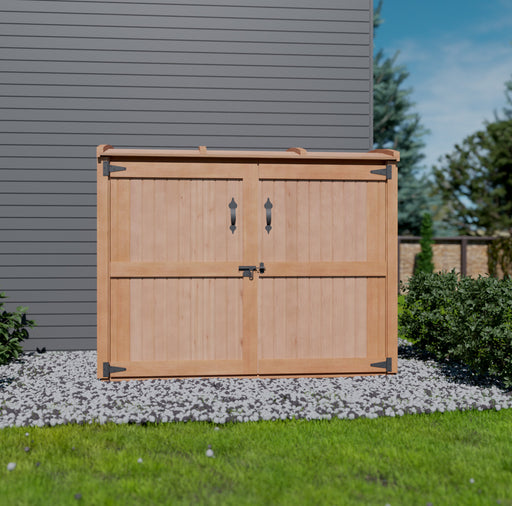 A wooden Outdoor Living Today 6x3 Oscar Waste Management Shed with double door, situated on a grassy lawn beside a stone pathway, under a clear sky.