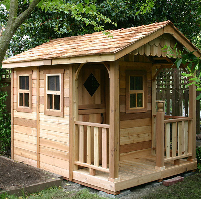 Outdoor Living Today Sunflower Playhouse with front porch and decorative lattice, integrated into a garden environment