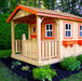 Vibrantly accented Outdoor Living Today Sunflower Playhouse, showcasing a two-tone color scheme with red trim on a porch-lined facade