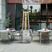 A commercial setting featuring the Vesta Flame Patio Heater on a restaurant's outdoor patio, providing a warm welcome to patrons.