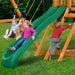 Kid sliding, kids swinging, and boy climbing on the Gorilla Playsets Outing With Monkey Bars Swing Set