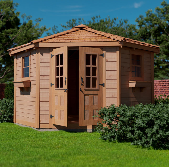 The Penthouse Garden Shed 9x9 features double door that is partially open, providing a glimpse of the interior. The shed is positioned on a grassy lawn beside a stone pathway, under a clear sky. Tall green trees surround the area, creating a serene outdoor setting.