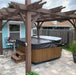 Outdoor Living Today Pergola with Retractable Canopy 8×10 providing elegant coverage over a hot tub.