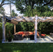 Outdoor Living Today Pergola with Retractable Canopy on a cement pad with outdoor furniture