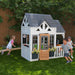 Outdoor playset on a backyard with kids playing