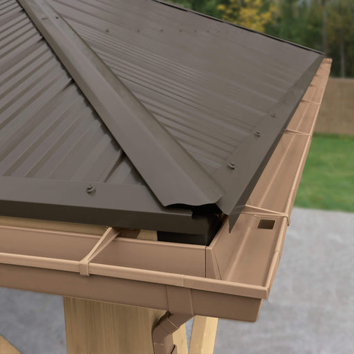 Close-up view showing the detail of the Yardistry Meridian rain gutter kit attached to the corner of a gazebo roof, highlighting the kit's compatibility and design for efficient rainwater management.