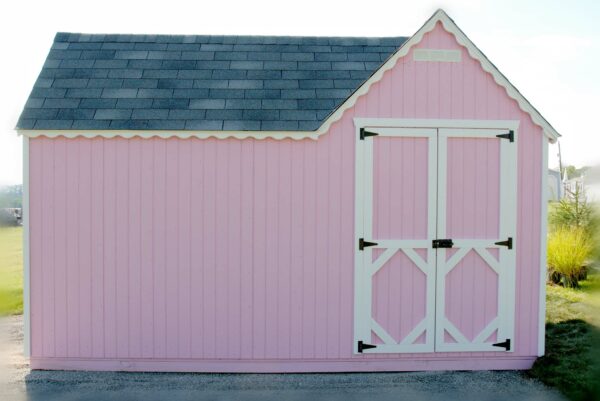 Rear view of Little Cottage Company Sara's Victorian Mansion Playhouse in pink