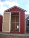 The open entrance view of a 5x8 EZ-Fit red dog kennel, highlighting the sturdy interior and construction.