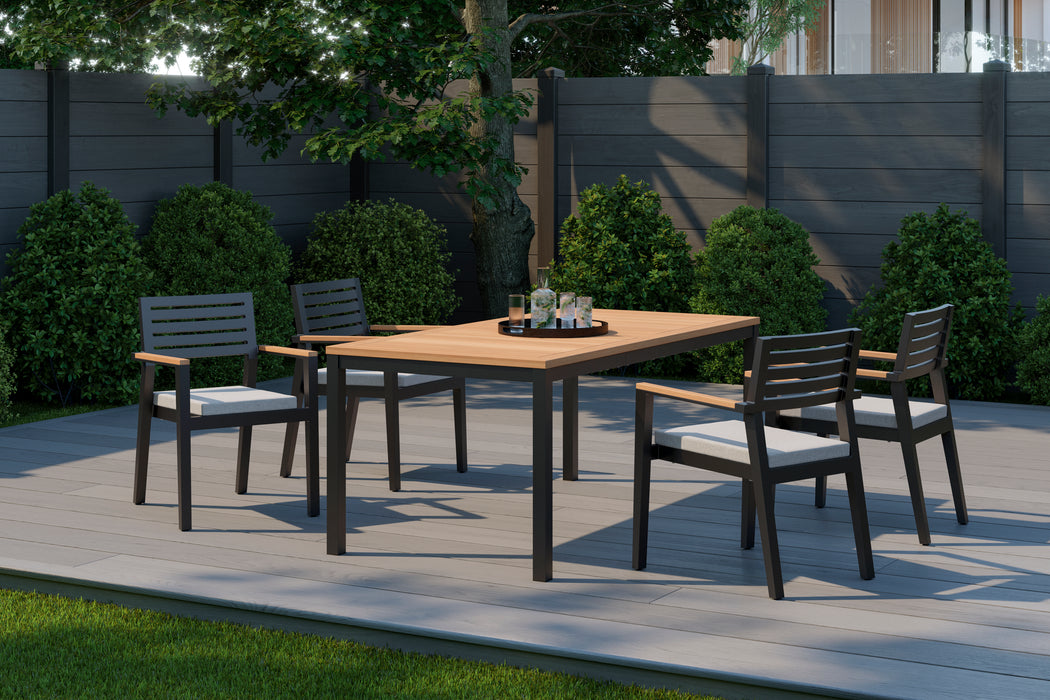 Outdoor patio setting with Rhodes 4-seater dining set including a 72-inch table, chairs with canvas natural cushioning in a garden backdrop.