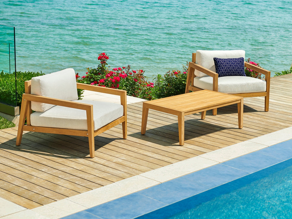 Two Rhodes chat chair set  beside a pool with ocean view.