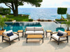 Rhodes Furniture Set with Canvas Natural cushions placed poolside with ocean view.