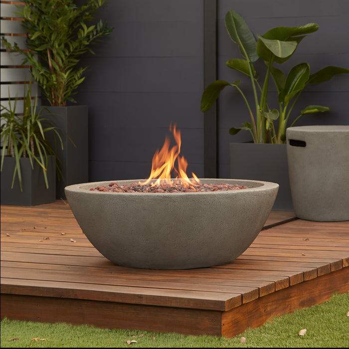 Riverside Round Natural Gas Fire Pit in an outdoor wooden deck setup