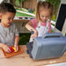 Kids play cooking on the outdoor playhouse