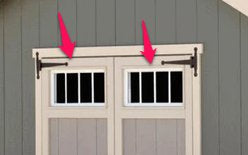 An EZ-Fit Sheds garage door with two arrows pointing in different directions.