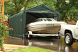 ShelterLogic ShelterTube 12 x 25 ft. Garage with a speedboat being hauled out