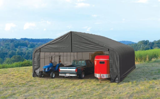 Sheltercoat 28x28 providing shade for a tractor, pick up truck, and a horse trailer
