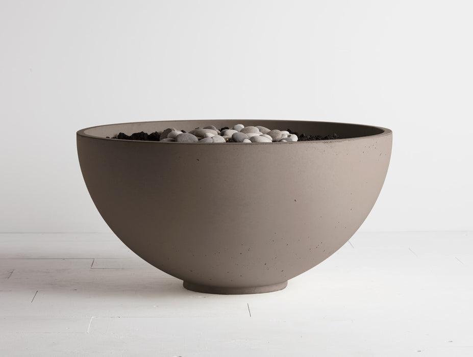 Shiitake Solus Hemi fire pit, showcasing an elegant concrete design with the versatility of flame adjustment.