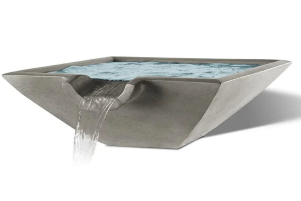 A square Camber Water Bowl fountain in shale gray. Water flows from a rectangular spout into the basin.