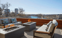 Chic Solus Decor Firetable enhancing a rooftop lounge in Texas, with a scenic city backdrop and comfortable seating area.