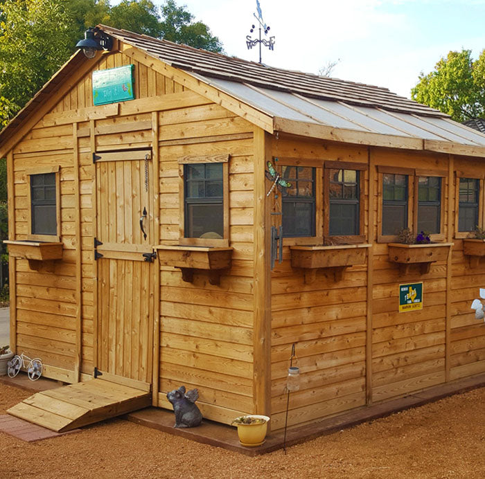 OLT Sunshed Garden Shed equipped with flower boxes, a ramp and shingles