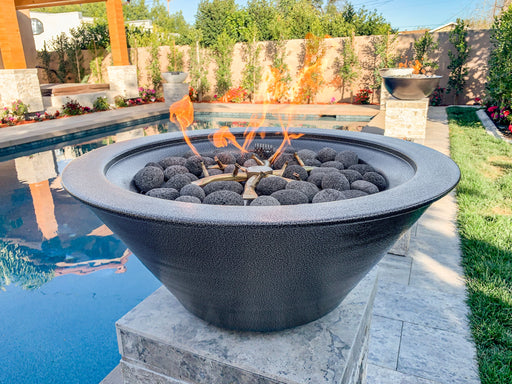 The Outdoor Plus's black round Cazo powder-coated metal fire bowl enhancing the ambiance of a modern backyard with its lively flames, in poolside