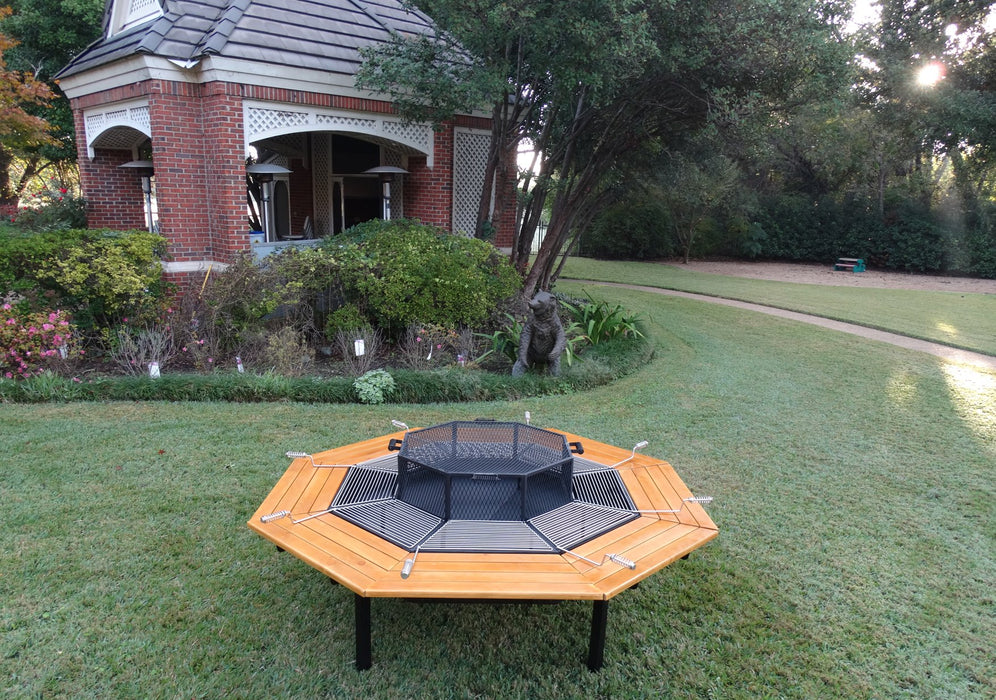 The Jag Eight Fire Pit Grill 3-in-1 BBQ Grill, Fire Pit & Table outside the house
