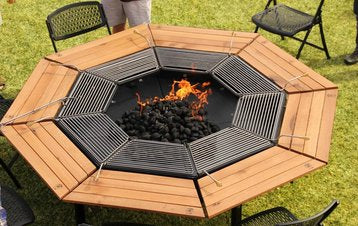 The Jag Eight Fire Pit Grill 3-in-1 BBQ Grill, Fire Pit & Table with burning charcoal