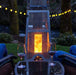 Big Timber Elite® Patio Heater with a table and wine glass