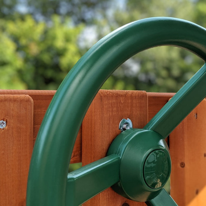 A detail shot of the green steering wheel of the Swing Set