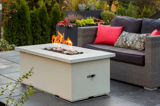 Solus Halva Firetable set in a lush urban garden, offering a warm flame for cozy conversations on cool evenings.