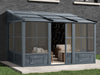 Florence Wall mounted Solarium 8x12 gazebo with a slate metal roof installed in a backyard setting.