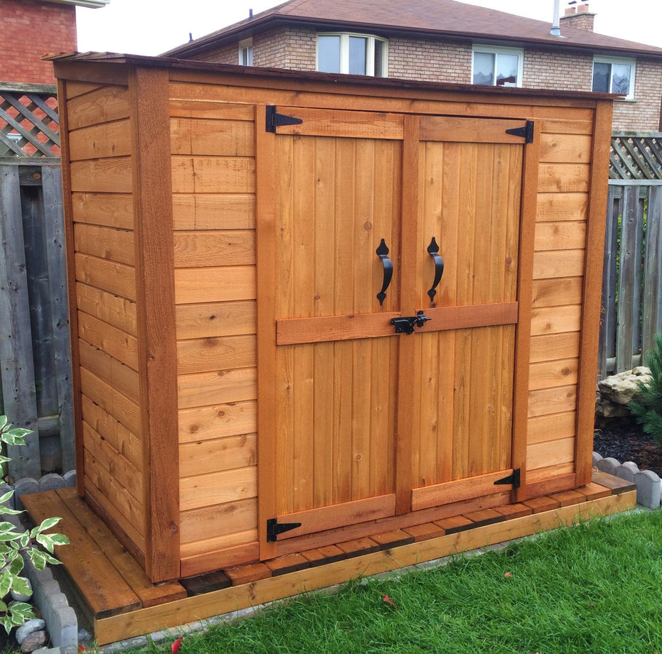 6x3 Garden Chalet lush green background with a wheelbarrow