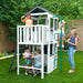 Kids playing on the wooden view playhouse