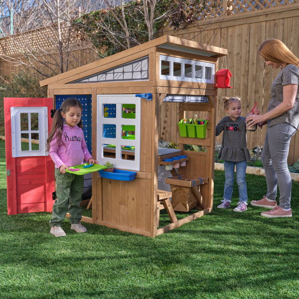 Kids playing on the workshop playset