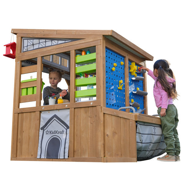 Kids playing on the wooden playset