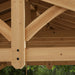 Underneath view showing the intricate wooden structure and aluminum roof of the Carolina Cedar 11x13 Pavilion.